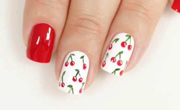 red nail designs: many ladies prefer to decorate the ring finger with patterns making for perfect summer red nail designs
