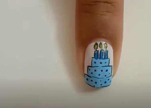 Birthday Nail Ideas: Step 3, in order to enhance the party look, draw buntings and other patterns as you like randomly
