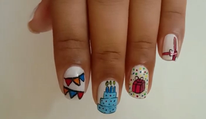 Birthday Nail Ideas: Step 4, apply a fast-drying top coat and seal the nail art
