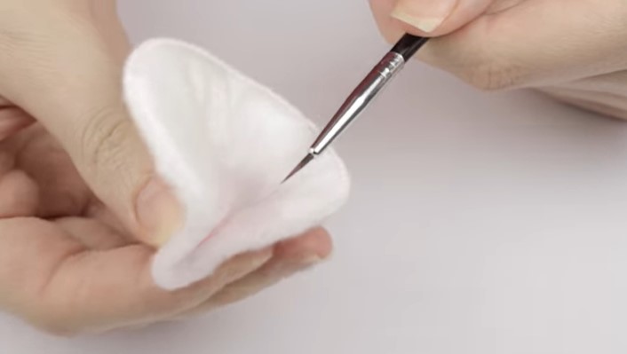 How To Clean Your Nail Brush: Step 1, proceed to wipe your brushes down using a lint-free cloth
