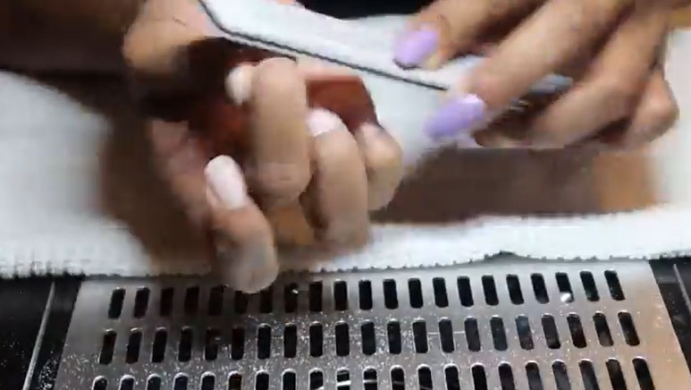 How To Remove Polygel Nails: Step 3, use a gentle file or buffer to remove any remaining polygel off the surface of the nail
