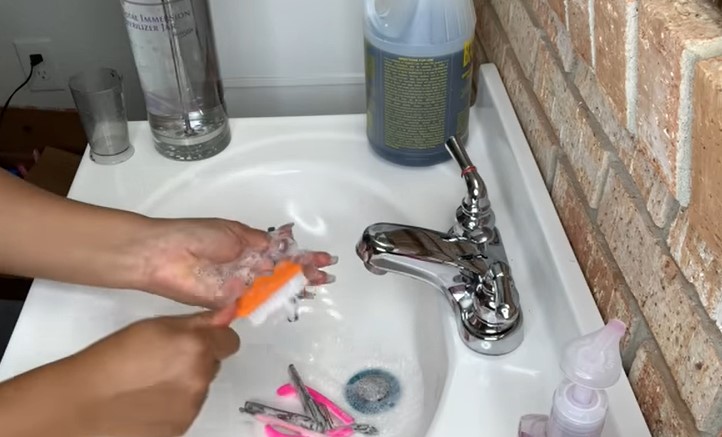How To Sterilize Nail Tools: Step 1, start by getting a clean and dry scrubbing brush and dust away any dust and debris 