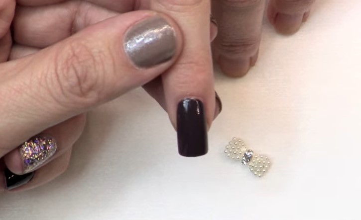 Nail Charms: Step 1, start out by applying your base coat 
