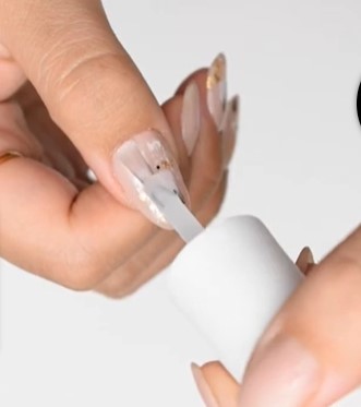 Neutral Nail Designs: Step 4, once your polish is dry, apply a top coat to lock your design in
